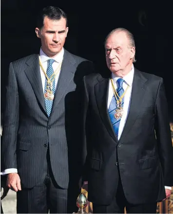  ?? Pictures / AP ?? King Juan Carlos is handing the crown to Prince Felipe.