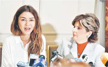  ??  ?? Mimi Haleyi (left), a former production assistant, flanked by her lawyer Gloria Allred, speaks during a press conference in New York on Tuesday during which she alleged to have been sexually assaulted by movie mogul Harvey Weinstein. More than 40 women...