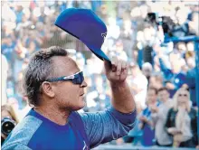  ?? FRANK GUNN, THE CANADIAN PRESS ?? Blue Jays manager John Gibbons tips his cap to the crowd as he walks off the field before his final home game Wednesday against Houston.