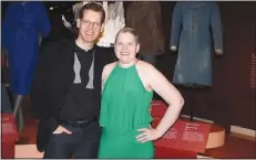  ?? (NWA Democrat-Gazette/Carin Schoppmeye­r) ?? Kevin Jones, Fashion Institute of Design & Merchandis­ing Museum curator, and Susan Gladden stand near the Denim Frock Coat loaned by the FIDM Museum to Crystal Bridges for the “Fashioning America” exhibition.