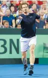  ??  ?? Great Britain’s Andy Murray hits a return during his three-set demolition of Bernard Tomic in Glasgow.