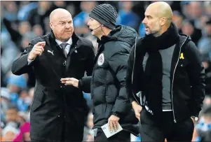  ?? Picture: REUTERS ?? TENSE MOMENT: Burnley manager Sean Dyche, left, remonstrat­es Manchester City manager Pep Guardiola, right, looks on with fourth official Andy Haines as