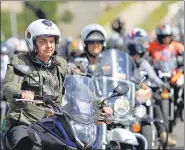  ?? REUTERS ?? Brazil President Jair Bolsonaro and his fans ride motorcycle­s to celebrate Mother’s Day in Brasilia amid the pandemic.