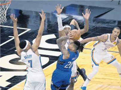  ?? PHELAN M
EBENHACK/AP ?? Magic guard Markelle Fultz goes up to shoot in front of Oklahoma City Thunder defenders during the first half Saturday in Orlando.