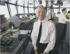  ??  ?? 0 Captain Jerry Kyd on board HMS Queen Elizabeth as she sails