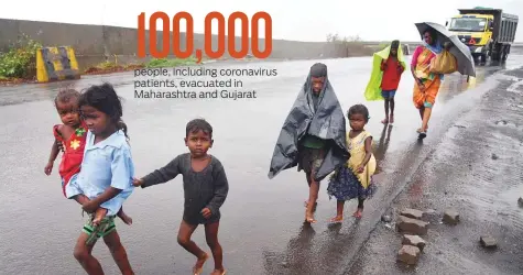  ?? PTI ?? A migrant family seeks shelter ahead of Cyclone Nisarga’s landfall, in Navi Mumbai, yesterday. The storm made landfall near Alibag, around 100km south of Mumbai, at noon. It then crossed Maharashtr­a’s coast, veering to the east of Mumbai and weakening.