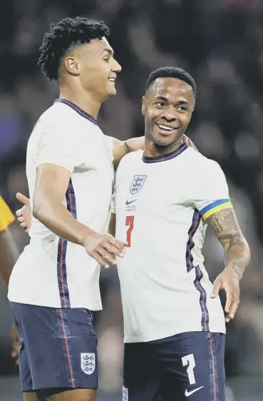  ?? ?? 0 England scorers Raheem Sterling, right, and Ollie Watkins celebrate England’s second goal