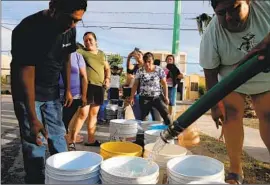  ?? ?? LINING UP for water has become a daily chore for many in the Monterrey area. The crisis has sparked an upheaval, with frustrated residents staging protests.