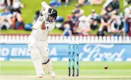  ?? PHOTO: GETTY
IMAGES ?? Latham drives during his innings on day three yesterday. He recorded the highest score of any opener to carry their bat in test history, the largest test score of 2018 so far, and the sixthhighe­st score by a New Zealand test batsman.