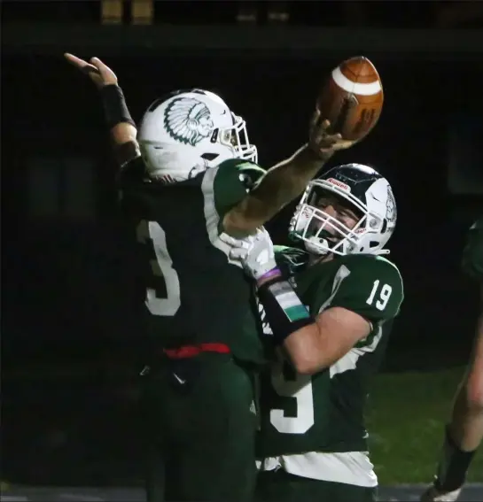  ?? JULIA MALAKIE / LOWELL SUN ?? billerica's dominic Gird, left, and Scott Einarson celebrate Gird's touchdown during friday’s game against Hanover.