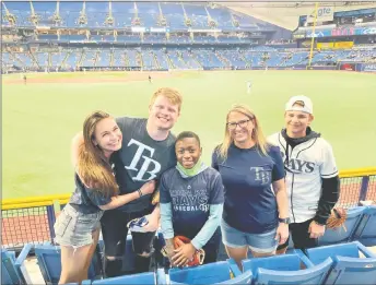  ?? ?? The Blair family at a Tampa Bay Rays home game in 2021: Sophia Heymans, from left, and Hunter, Ronnie, Danyel and PJ.