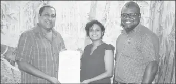  ??  ?? From left are CEO of Iwokrama Dane Gobin, Director of the Centre for Biological Diversity at UG Dr Guyanpriya Maharaj, and former Dean of the Faculty of Natural Sciences and member of the Iwokrama Science Committee Calvin Bernard following the signing of the MoU.