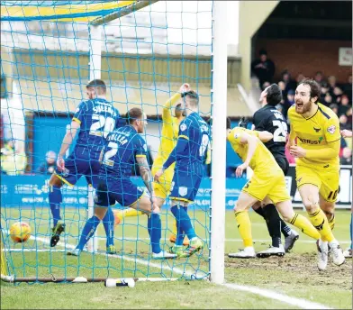  ??  ?? DAN THE MAN: Oxford forward Danny Hylton bundles the ball over the line and celebrates the opener