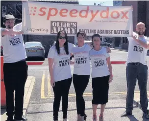  ??  ?? ●● Staff from Speedy Dox are among those raising funds for Ollie’s Army to help brother and sister Ollie and Amelia Carroll