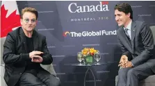  ?? GETTY IMAGES/FILES ?? U2 singer Bono, left, speaks with Prime Minister Justin Trudeau during a health conference in Montreal last year.