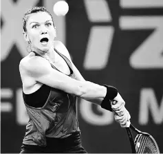  ??  ?? Halep hits a return against Daria Kasatkina during their second round women’s singles match at the WTA Wuhan Open tennis tournament in Wuhan, in China’s central Hubei province. — AFP photo