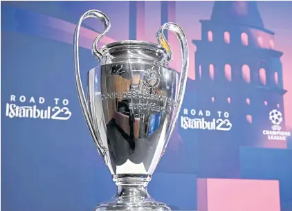  ?? AFP ?? The Champions League trophy is on display during the draw for the quarter-finals and semi-finals in Nyon.