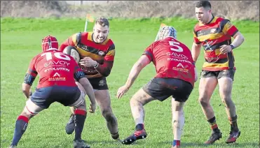  ??  ?? Ashford’s Andy Ticehurst tests the Aylesford defence