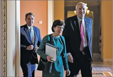  ?? AP/SUSAN WALSH ?? Sens. Jeff Flake (left) R-Ariz., Susan Collins, R-Maine, and Luther Strange, R-Ala., walk together Friday at the Capitol. Flake and Collins, who had been withholdin­g their support for the GOP tax plan, announced Friday that they would vote for the...