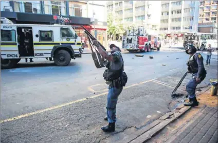  ?? Photo: Delwyn Verasamy ?? Armed to the hilt: The expectatio­n of violence escalating is argued to be one of the reasons police officers pre-empt ‘criminalit­y’ with intimidati­on and aggression, often worsening situations.