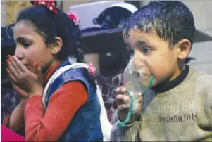  ?? AP PHOTO ?? This image released early Sunday, April 8, 2018 by the Syrian Civil Defense White Helmets, shows a child receiving oxygen through respirator­s following an alleged poison gas attack in the rebel-held town of Douma, near Damascus, Syria. Syrian rescuers...