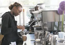  ?? Brian Feulner / Special to The Chronicle ?? Marurica Clark makes a drink at Blue Bottle Coffee in Oakland. The company is joining other Bay Area bakeries and cafes in the hot South Korean market.