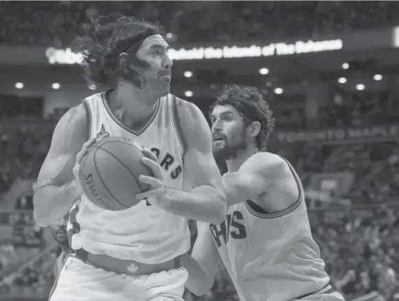  ?? CHRIS YOUNG/THE CANADIAN PRESS ?? Toronto power forward Luis Scola goes one on one with his Cleveland Cavaliers counterpar­t Kevin Love in exhibition last month. The Raptors will be counting on Scola for his veteran leadership.