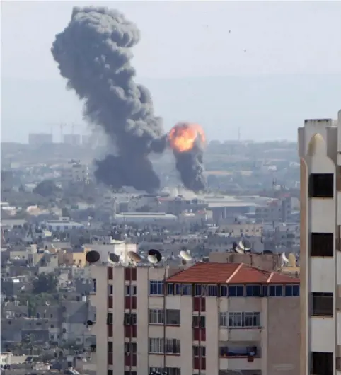  ?? (Reuters) ?? AN EXPLOSION from an air strike rocks Gaza.