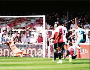  ?? PIC: David Holmes ?? FINISH: Torquay’s Armani Little fires in