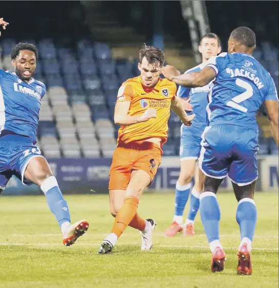  ?? Pictures: Nigel Keene ?? Marquis opens the scoring during last night’s 2-0 victory away to Gillingham in League One.