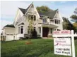  ?? — Reuters ?? A real estate sign advertisin­g a new home for sale is pictured in Vienna, Virginia.