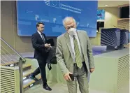  ?? [OLIVIER HOSLET, POOL PHOTO VIA THE ASSOCIATED PRESS] ?? European Union foreign policy chief Josep Borrell, right, wears a mouth mask after addressing a video press conference at the conclusion of a video conference of EU foreign affairs ministers, April 22, in Brussels.