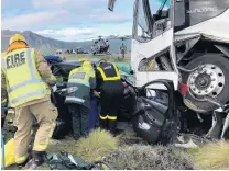  ?? PHOTO: SUPPLIED ?? Emergency services staff work at the scene of a fatal collision near Kingston yesterday.