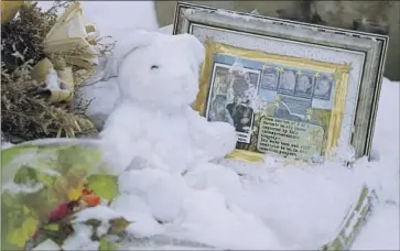  ?? Ted S. Warren Associated Press ?? A MEMORIAL sits outside the Moscow, Idaho, home where four University of Idaho students were found fatally stabbed on Nov. 13. A suspect was arrested in connection with the killings on Friday in Pennsylvan­ia.