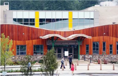  ?? ASSOCIATED PRESS PHOTOS ?? The new Sandy Hook Elementary School hosts a media open house on Friday in Newtown, Conn. The public is getting its first look at the school, which will replace the one torn down after a gunman entered it in December 2012 and killed 20 first graders...