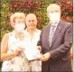  ??  ?? Sue Tilt, second from right, presented a certificat­e of thanks to Lords Palace Hotel. Right, President Ersin Tatar handing a certificat­e of thanks to Barbara Fursman.