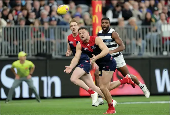  ?? Picture: AAP ?? Defensive rock: Melbourne backman Steven May prepares to take a mark during Friday night’s big win over Geelong at Perth’s Optus Stadium.