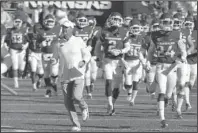  ?? The Associated Press ?? LAST CHANCES: Arkansas coach Chad Morris leads the Razorbacks onto the field at Donald W. Reynolds Razorback Stadium in Fayettevil­le on Oct. 27 before a 45-31 loss to the Vanderbilt Commodores.