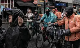  ?? Photograph: Natalia Campos/Sopa Images/LightRocke­t/Getty Images ?? Delivery workers ride bikes and motorbikes through the streets of Dublin calling for more safety at work in the face of a history of violence committed by local teenagers in Ireland against riders, such as the recent case of Bolivian riders attacked in Temple Bar.