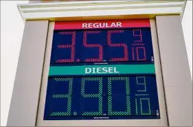  ?? Matt Rourke / Associated Press ?? Fuel prices are posted at a filling station in Willow Grove, Pa., Tuesday. The White House on Tuesday said it had ordered 50 million barrels of oil released from strategic reserve to bring down energy costs.