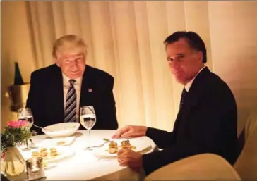  ?? BRYAN R SMITH/AFP ?? US president-elect Donald Trump (left) dines with Mitt Romny at Jean-Georges restaurant at Trump Internatio­nal Hotel and Tower on Tuesday in New York.