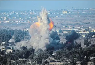  ?? LIOR MIZRAHI GETTY IMAGES ?? Syrian government forces pound Quneitra, the Syrian province from where the Israeli military rescued hundreds of civil defence voluteers with their families Saturday night.