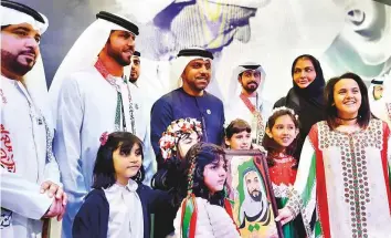  ?? Sana Jamal /Gulf News ?? UAE Ambassador to Pakistan Hamad Obaid Ebrahim Al Za’abi with members of Al Maqabeel military band and students in Islamabad at the cultural event to celebrate UAE National Day.