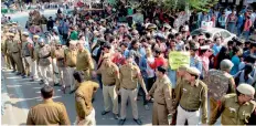  ?? — PTI ?? Police detains an ABVP supporter after its clash with AISA members at North Campus in New Delhi on Wednesday. Cops try to block Left-backed members from marching towards the Maurice Nagar police station to file a case against ABVP activists.