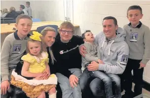  ??  ?? Ed Sheeran with Ollie, Amelia and the rest of the Carroll family