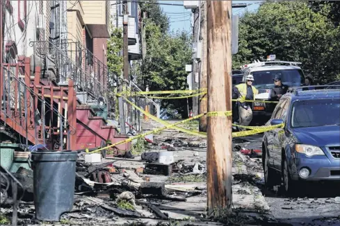  ?? Will Waldron / Times Union ?? Crews investigat­e and clean up after a fire engulfed several Myrtle Avenue buildings beginning late Thursday night. Demolition was expected to start late Friday. Fire officials know where the blaze started but were still looking to determine the cause.