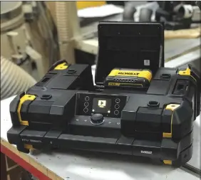  ??  ?? This bluetooth music player and battery charger clips together with storage boxes and trays in DEWALT’S TSTAK system.