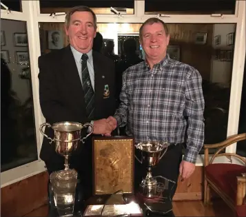  ??  ?? Baltinglas­s Golf Club Captain John Kelly presents the Golfer of the Year trophy the singles match play Cup and the Club Championsh­ip Cup to the club’s Golfer of the Year award winner Michael O’Neill at the awards night last weekend.