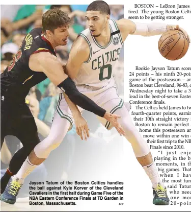  ?? AFP ?? Jayson Tatum of the Boston Celtics handles the ball against Kyle Korver of the Cleveland Cavaliers in the first half during Game Five of the NBA Eastern Conference Finals at TD Garden in Boston, Massachuse­tts.