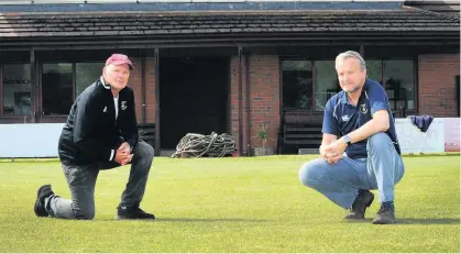  ??  ?? Pitch perfect Grounds contractor Albert Simpson, left, and Ayr Cricket Club chairman Stuart Jefferson